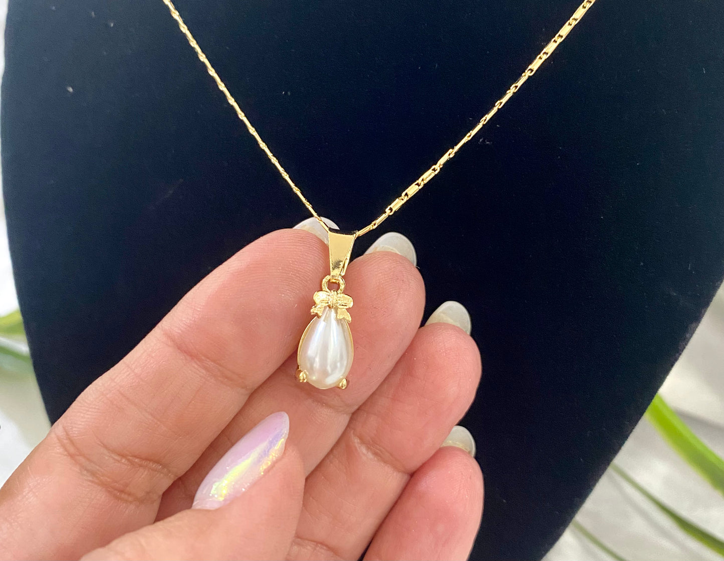 Juego de collar y aretes Aspa con Perla 13x9