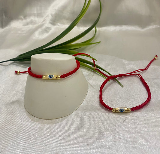 Pulso tela roja con tubo ojo , oro laminado